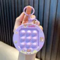 Lila Hamster Quick Push Fidget Spielzeug Schlüsselanhänger für Stressabbau Dekoration - Lila