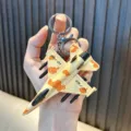Cool desert camouflage fighter jet model keychain for creative schoolbag decoration - F-168 Fighter (42-F168) / Desert Camouflage