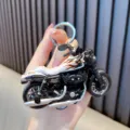 Cool creative motorcycle model keychain pendant with orange flame patterns and metal ring - White