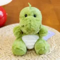 Adorabile dinosauro di peluche verde in posa seduta con pelliccia morbida e pancia bianca - Stile Base / 15cm / Verde