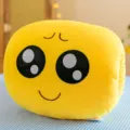 Soft yellow plush emoji nap pillow with hand warmer pockets and cute embroidered face - Pleading Face / 30 cm