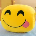 Yellow plush emoji nap pillow with hand-insert design and tongue-out smiling face detail - Foodies / 30 cm