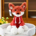 Cute plush fox toy wearing a red hoodie sitting in a white fluffy textured pet bed - S / Little Fox
