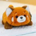 Adorable palm-sized red panda plush toy animal doll resting on a white computer keyboard - Red Panda