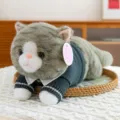 Adorable plush cat toy wearing a dark green knitted sweater in a cozy prone position - 35 cm / Civet Cat