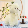 Adorable soft cream alpaca plush toy with a ribbon bow on a blue checkered table - White / 25cm