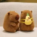 Cute brown Capybara plush toy with a small yellow pear-shaped backpack on a soft surface - Pear Backpack