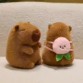 Cute brown capybara plush toy featuring a unique pink peach backpack accessory details - Peach Backpack