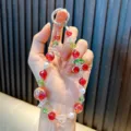 Handmade elegant red cherry beaded keychain with rhinestone charm and pearl accents - Red Cherry