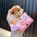 Cute perfume bottle keychain featuring a mini tiger and purple liquid shaker effect - Purple