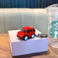 Red cartoon SUV toy car keychain with pull-back function for backpacks and gift collections - Red
