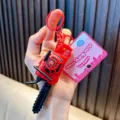 Mini red pull-cord vibration chainsaw toy keychain variant with cute pink brand tag pendant - Red