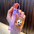 Purple football quicksand keychain with liquid glitter and a motivational strap - Purple