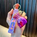 Vibrant purple metallic lucky bag keychain with colorful strap and Good Lucky text - Purple