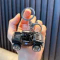 Miniature black police car model keychain toy with pull-back function for bags - Machine Gun