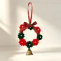 Close-up detail of a handmade Christmas pipe cleaner flower wreath with golden bell ornament - Style 5