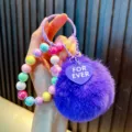 Cute purple plush pom-pom keychain with iridescent beaded charm for school bags and gifts - Purple (Random Beads Tag)