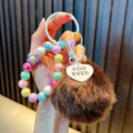 Cute colorful beaded keychain with fluffy brown faux fur pom-pom and heart-shaped charm - Coffee (Random Beads Tag)