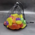 Multi-colored reusable plastic ice cubes in a black mesh bag for chilled summer party drinks - 50 Pieces (20x23cm)