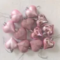 Close-up of 12pcs pink heart ornaments showing matte, shiny and glittery textures. - Pink (Shiny Matte Glitter)