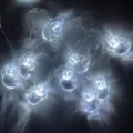 Halloween ghost-shaped LED string lights with cool white glow for party decoration - Ghost