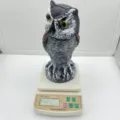 Realistic plastic owl decoy for garden pest control shown on a scale weighing 290.5g - Shaking Head Round Ear / Bag Packaging