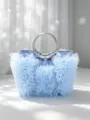 Close-up of a sweet light blue handbag with delicate tulle ruffles and metal ring handles. - Light Blue