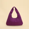 Front view of a purple vintage crescent underarm bag with elegant quilted stitching detail - Purple