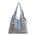 Hellblaue Strick-Schultertasche mit rundem Ring und Evil Eye Quastenanhänger-Dekor - Blau