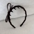 Detailed view of coffee brown velvet headband with delicate bow and anti-slip teeth - Bow Headband / Brown