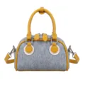 Trendy denim bowling bag featuring yellow contrast stitching and top leather handles - No Pendant / Yellow