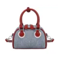 Trendy denim bowling bag with red contrast leather trim handles and shoulder strap - No Pendant / Red