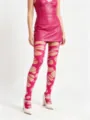Close-up of pink irregular cut-out leggings in gothic punk style with large holes - One Size / Rose Red