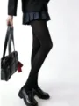 High-quality opaque black thermal tights for women suitable for winter school uniform wear - One Size / Stirrup / Black