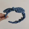 Close-up of retro French polka dot headband with rabbit ear bow and non-slip teeth - Light Blue Polka Dot Bow Headband