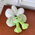 Detailed shot of a cute plush frog flower scrunchie with green polka dots and gingham patterns - Green Frog
