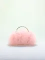 Close-up detail of a romantic pink tulle ruffled evening handbag with gold-tone handle - Pink