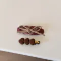 Detail view of a vintage plaid hair clip with bow and brown fabric heart hairpin - Pair Clip / Coffee Brown Heart (1#)