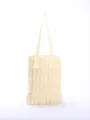 Close-up detail of light yellow multi-layered pleated ruffle tote bag with thin straps - Multi-Layer Pleated Style / Apricot