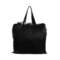 Elegant black large faux fur tote bag featuring long shaggy hair and black leather straps - Black