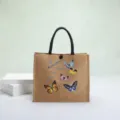 Eco-friendly natural linen tote bag with colorful butterfly prints and black woven handles - Colorful Butterfly