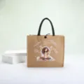 Eco-friendly burlap tote bag with a trendy cartoon girl print and motivational English text - Get Rich Girl