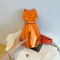 Stylish orange metallic cat-shaped crossbody chest bag with an adjustable red strap - Orange