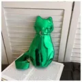 Shiny green cat-shaped crossbody bag with decorative belt buckle and adjustable strap - Verdant
