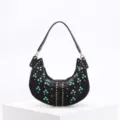 Detailed view of black crescent underarm bag with turquoise beads and gold studs - Black