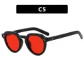 Gafas de sol vintage con montura negra irregular y vibrantes lentes rojas - Montura negra brillante lentes rojas
