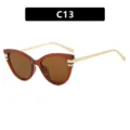 Élégantes lunettes de soleil œil-de-chat pour femmes avec verres bruns et branches dorées - Monture Thé Foncé Verres Thé