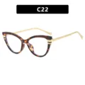Lunettes tendance œil de chat avec monture écaille et branches en métal doré chic - Monture Écaille Verres Transparents