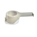 Detailed macro view showing the discharge nozzle and handle of this grey plastic food sealing clip - Gray
