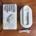 Detailed view of white electric pet spray massage brush with charging cable and box - Spray Brush / Porcelain White